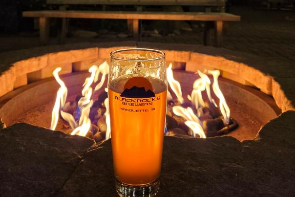 A pint in front of the fire pit at Blackrocks Brewery