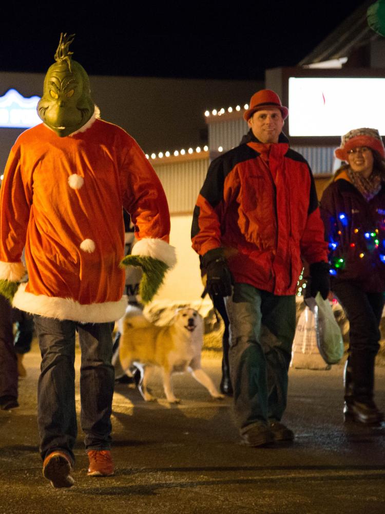 The Grinch walking down Third Street in the Holiday Parade in Marquette, MI