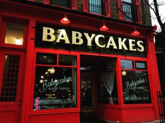 The bright red exterior of Babycakes Muffin Co.