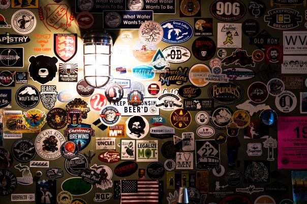 Wall of stickers at Ore Dock Brewing Company