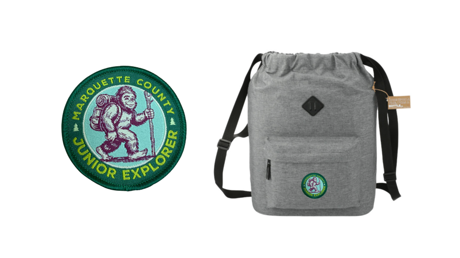Jr Explorer patch feature a little "bigfoot" with a hiking stick and a backpack with a sewn on "Jr Explorer" patch