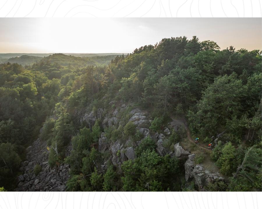 An aerial view of the Malton Loop surrounded by the lush forest on RAMBA trails