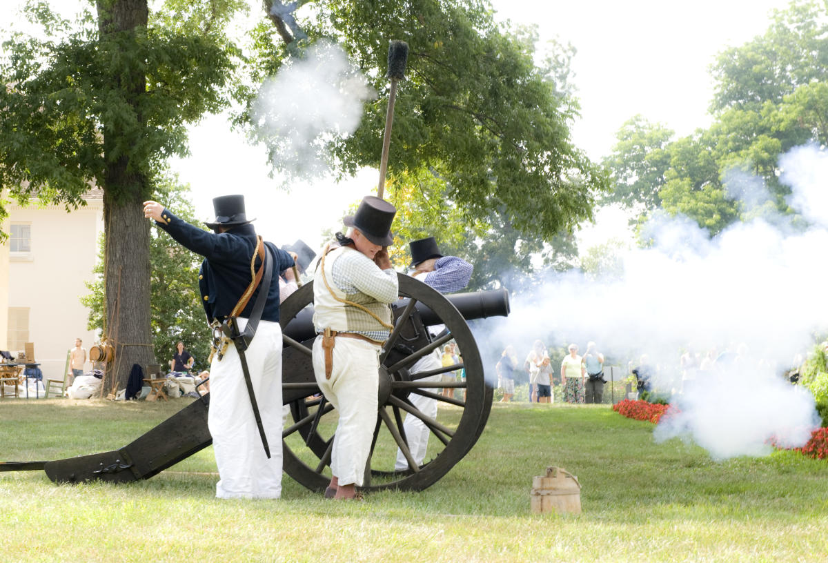 Men firing a cannon at reenactment in Prince George's County