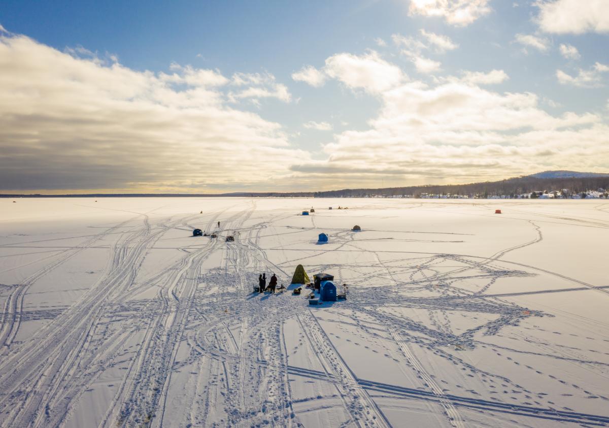 A drone image of people ice fishing in Big Bay, MI