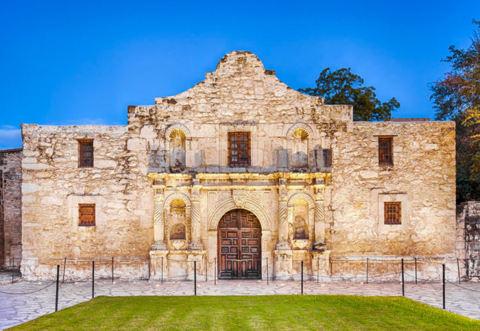 The Alamo facade at dusk in San Antonio.