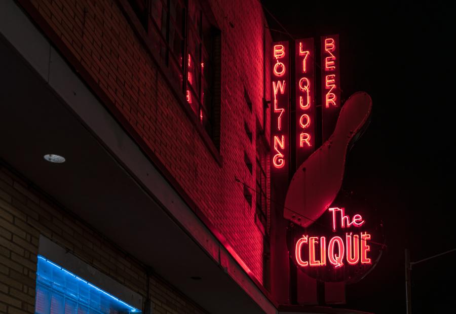 The Clique Lanes neon sign at night in Grand Rapids