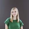 Headshot on a neutral background of Lilly Baker, Specialty Sales Manager at Experience Grand Rapids.