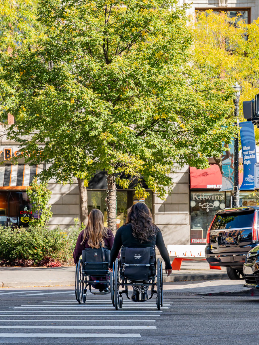Two women in wheelchairs exploring downtown Grand Rapids.