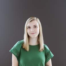 Headshot on a neutral background of Lilly Baker, Specialty Sales Manager at Experience Grand Rapids.