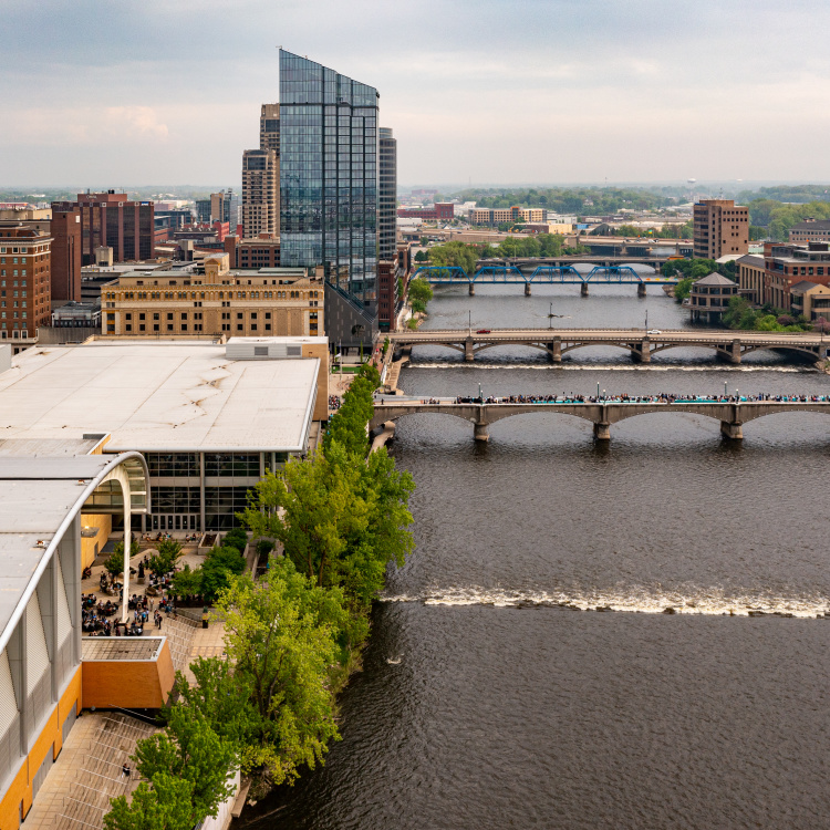 Drone photos of an outdoor event at DeVos Place and the Gillette Bridge near the Grand River in downtown Grand Rapids.
