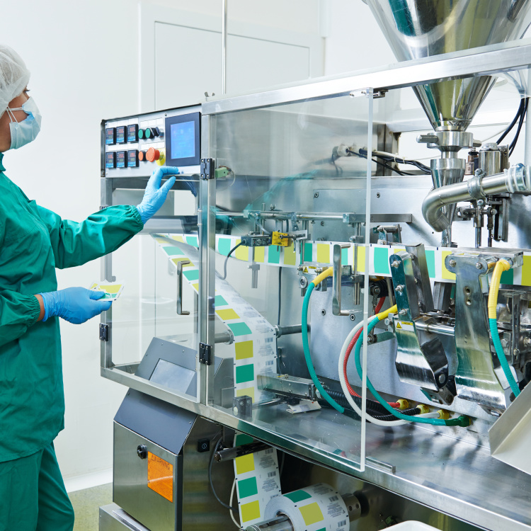 pharmaceutical factory woman worker operating production line at pharmacy industry manufacture factory