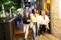 Group of people leaving restaurant