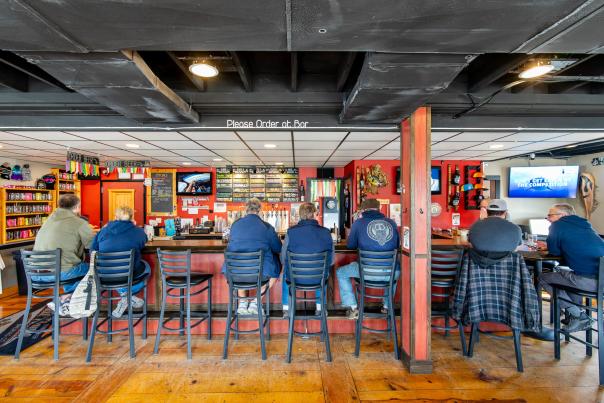 Men ordering at White Flame Brewery.