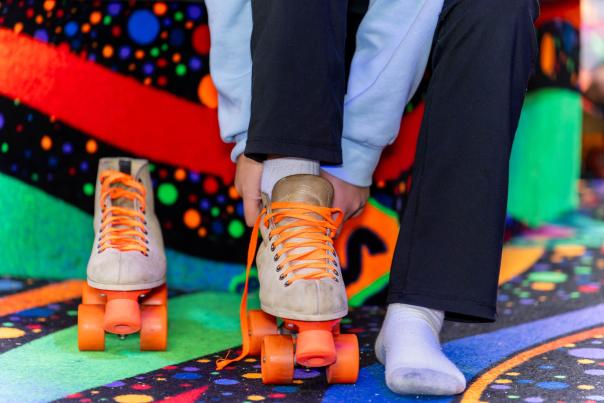 Girl putting skates on