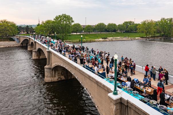 Drone photos of an outdoor event at DeVos Place and the Gillette Bridge near the Grand River in downtown Grand Rapids.