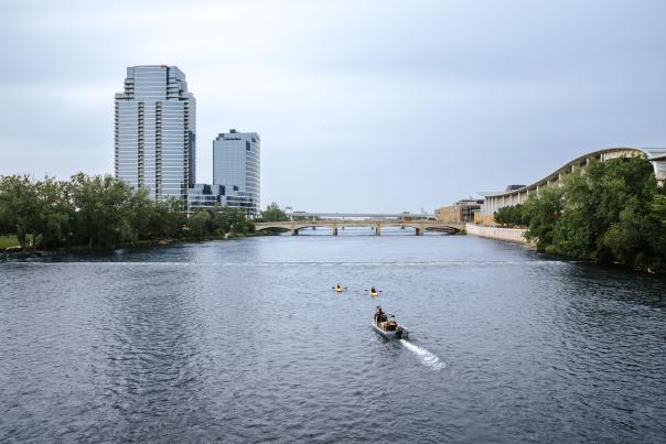 Kayakers being filmed in the Grand River