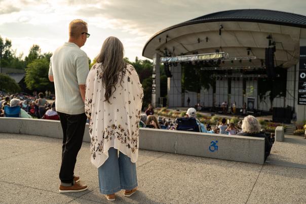 Couples enjoying a summer concert at the Frederik Meijer Gardens and Sculpture Park, 2023