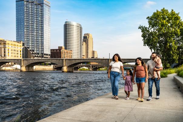 Family walking by Ah-Nab-Awen Park, 2023