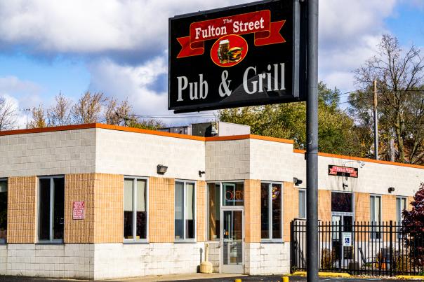 Exterior view of Fulton Street Pub & Grill sign and front entrance.