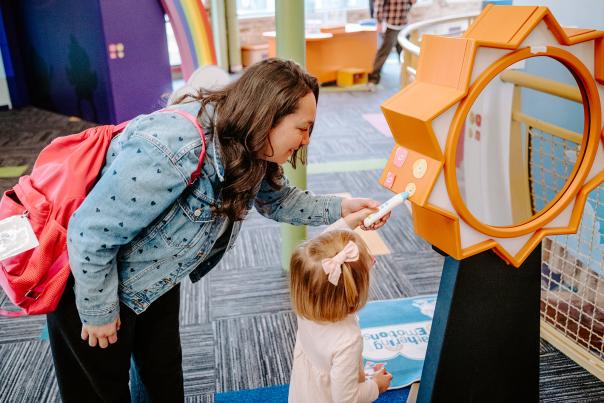 A mother and daughter interact with an exhibit at the Grand Rapids Children's Museum.
