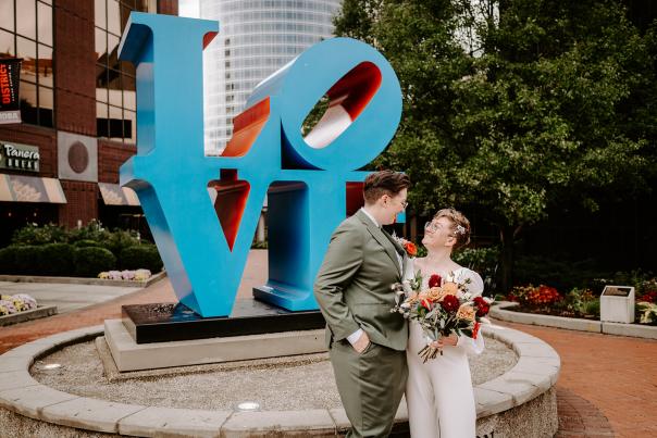 Couple posing for wedding photo in downtown Grand Rapids.