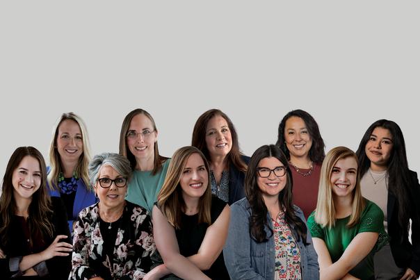 10 members of the Experience Grand Rapids Sales Team smile for professional photo