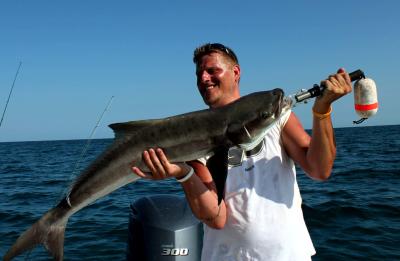 Ben Chaya from Minnesota with a nice cobia caught while fishing with Capt. Tom.