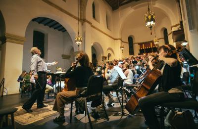 Conductor John V. Sinclair leads rehearsal