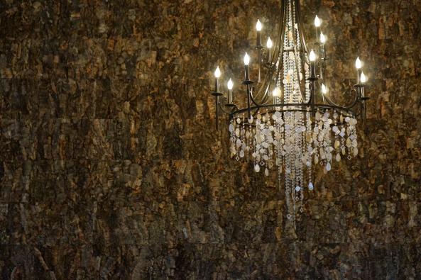 cork wall and chandelier