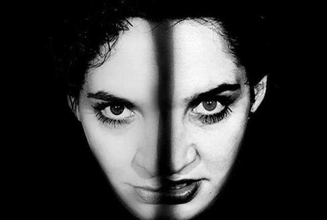 Image of a the same face split in two showing different sides of personality