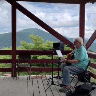 Randy Flack on the Orchard Pavilion Stage