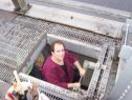 Bertolozzi climbing down to the traveler below the roadway deck