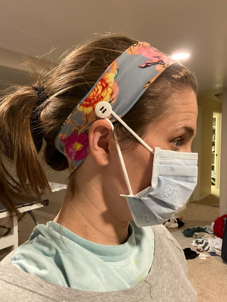 Nurse wearing headband with buttons