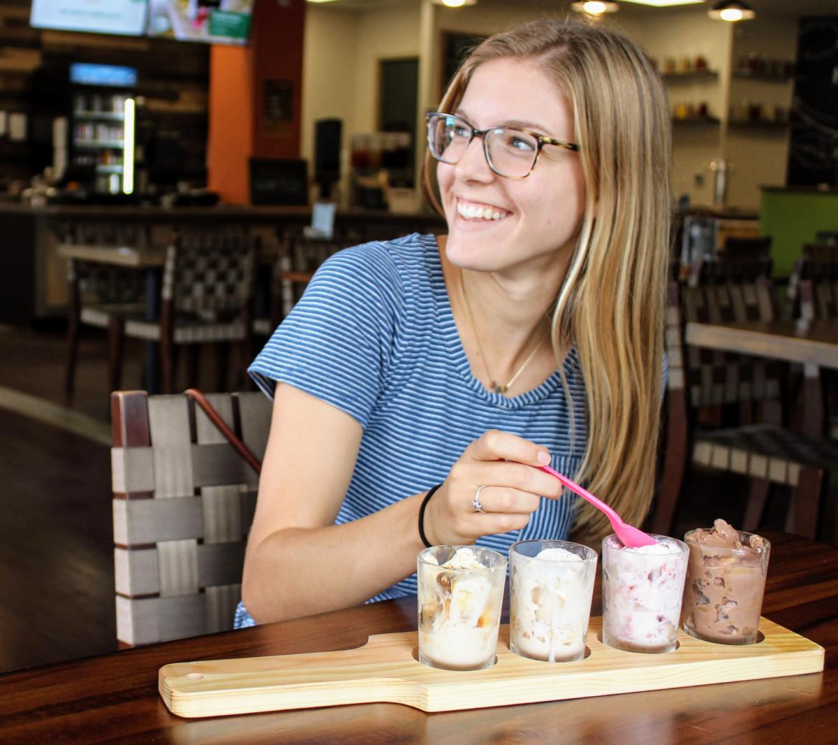 A woman trying an Ice Cream Flight from Hometown Harvest Kitchen in Frederick County, MD