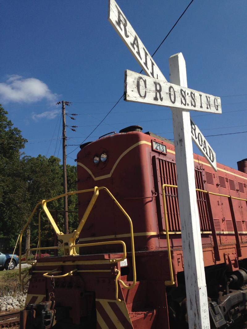 Train cart showcasing the railroad crossing sign