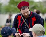 reenactors share history with children at Genesee Country Village and Museum