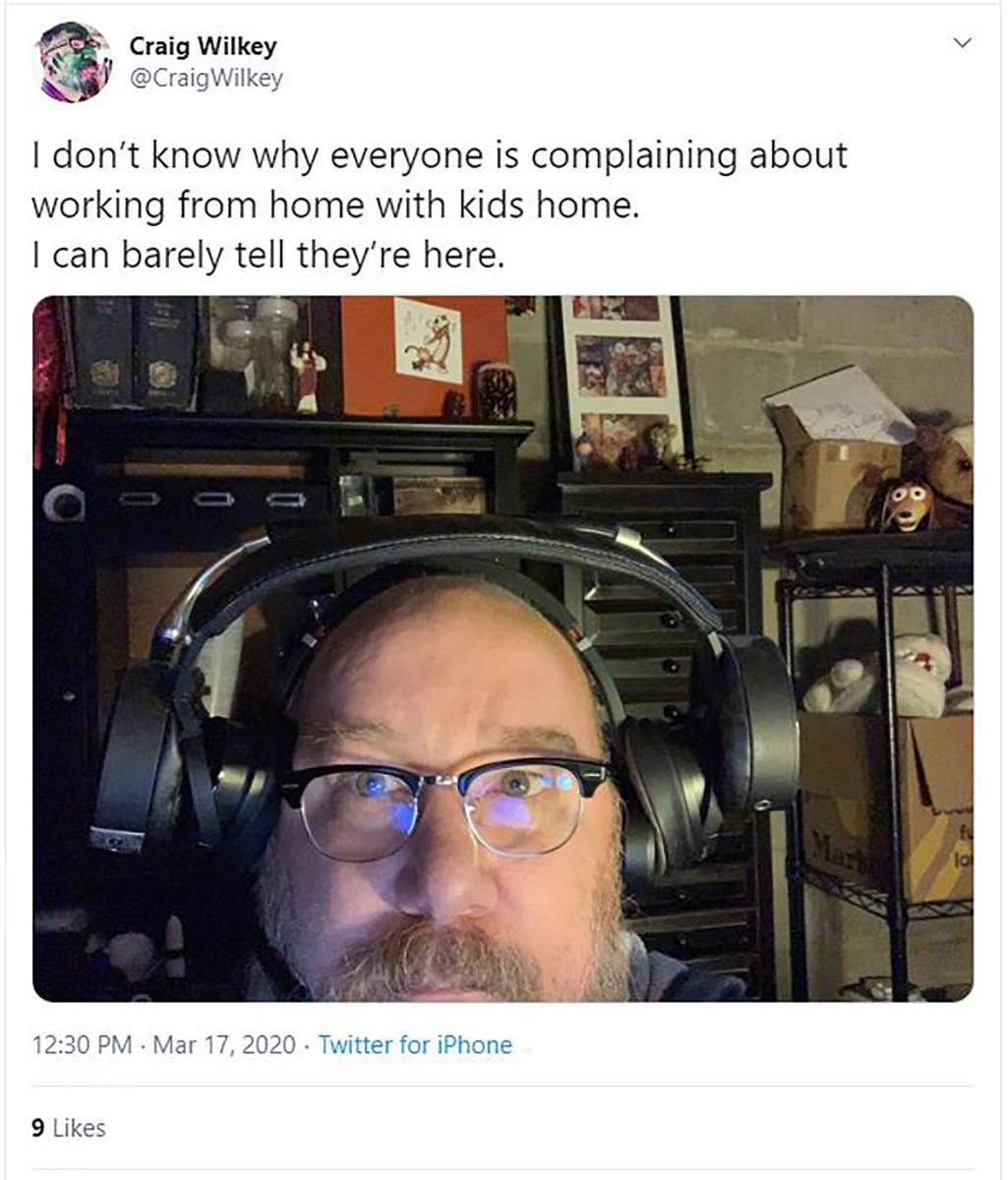 Man wearing two pairs of headphones