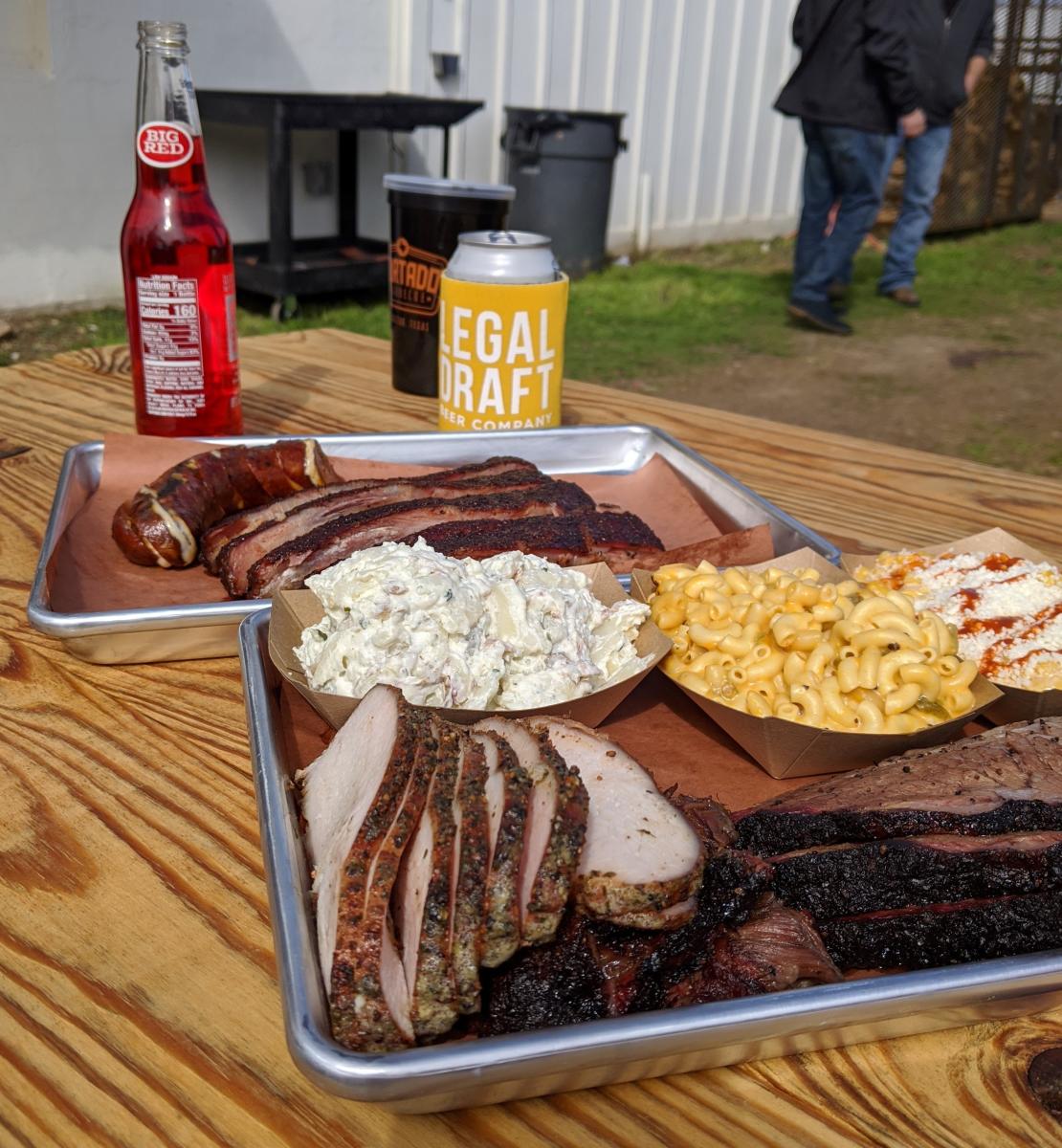 tray of barbecue, macaroni and cheese and potato salad