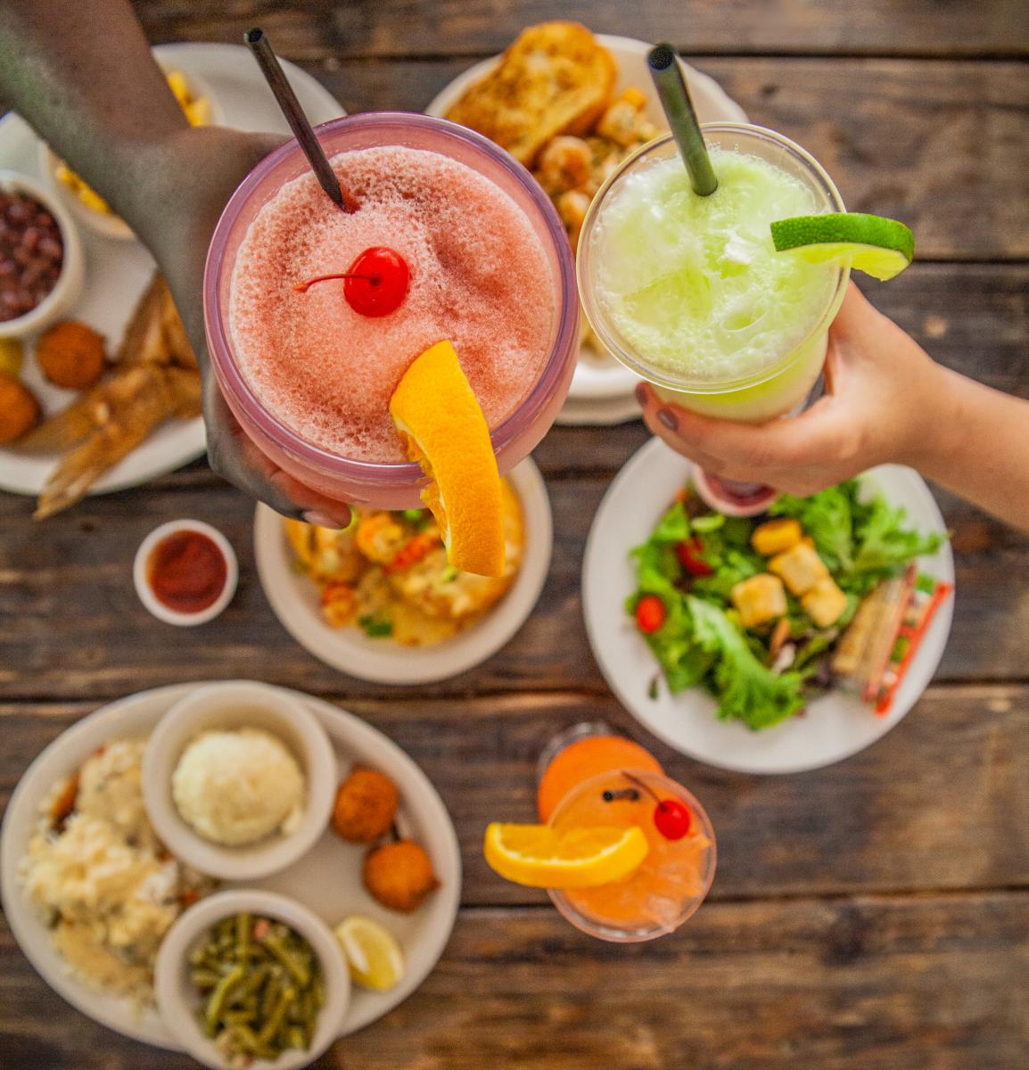 Friends share drinks at Pine Tree Lodge in Beaumont, TX.