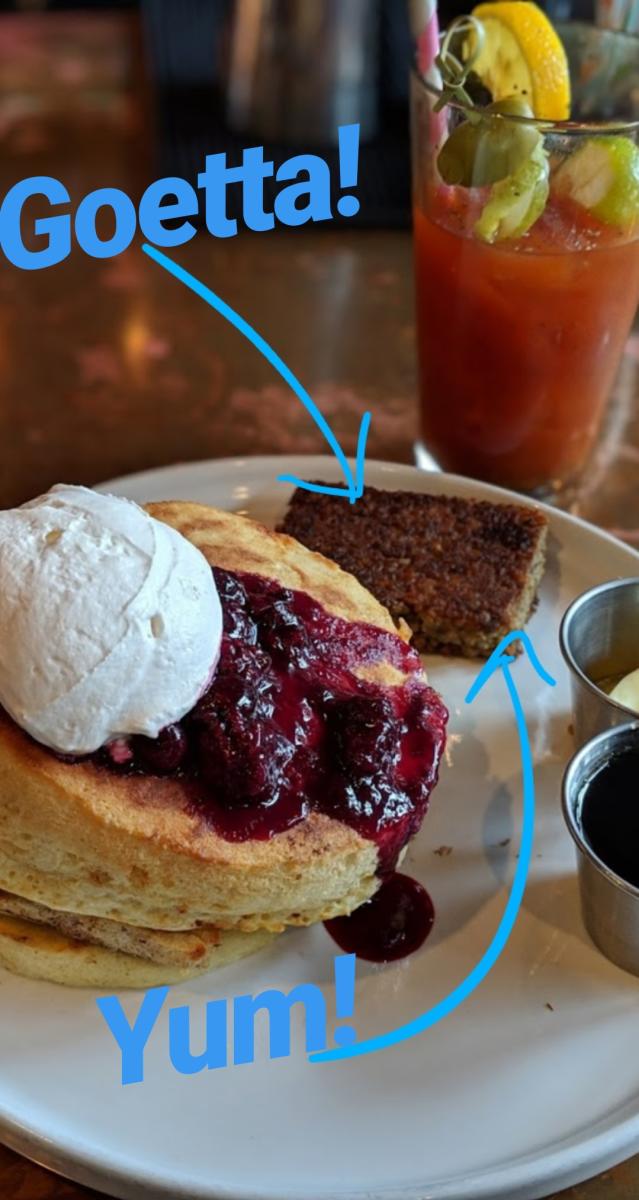 A slice of homemade goetta at Otto's in Covington, KY, surrounded by a Bloody Mary and lemon pancakes