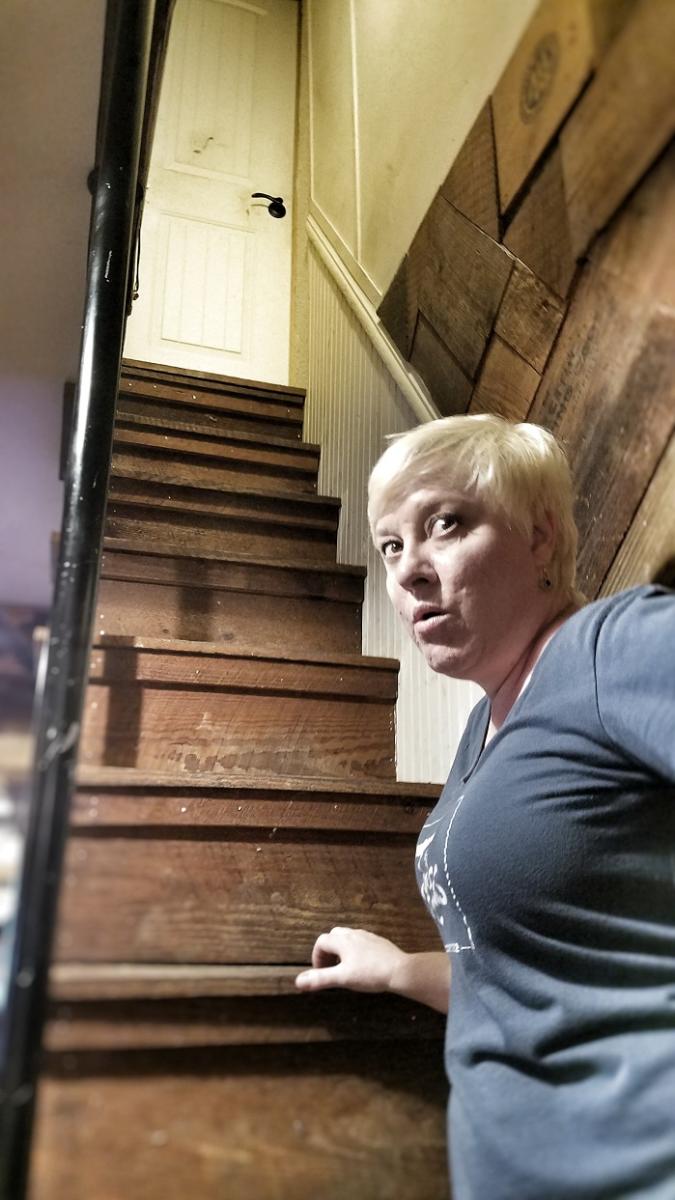 Woman Showing The Haunted Tejas Stairs In Tomball, TX