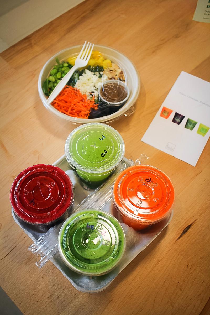 Freshii Metaboost Salad to-go and carrying tray with juice cleanses