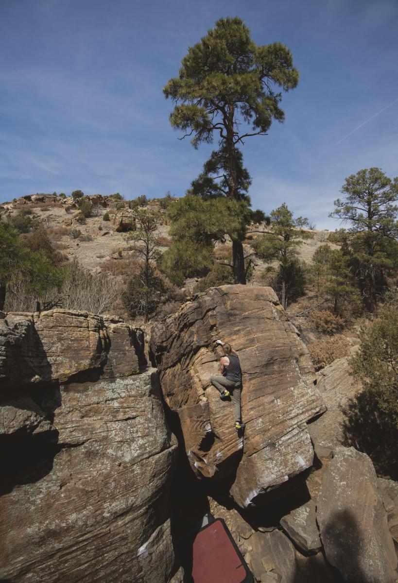 Matthew Stephens tackles Slug, a “problem” in the Jumbles area of Mesteño Canyon, part of the Kiowa National Grassland, New Mexico Magazine