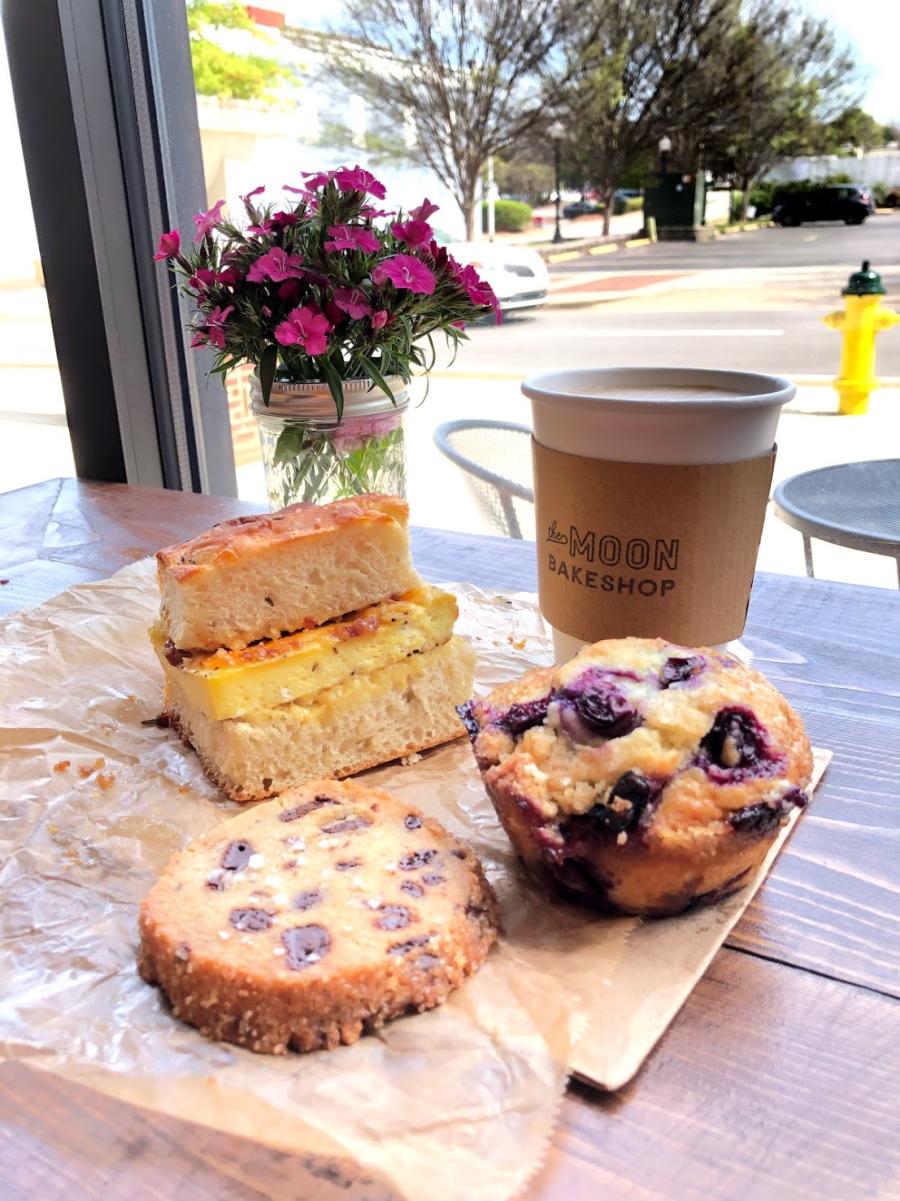 This breakfast from Moon Bakeshop includes a handmade breakfast sandwich, a muffin, and coffee.