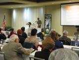 Dr. Timothy Abel, historian and adjunct professor of anthropology at Jefferson Community College and SUNY Canton, returns to the Oswego War of 1812 Symposium with a presentation about the archaeology of Col. Pike’s Cantonment. He is pictured here during an active discussion with a curious audience from last year’s event.