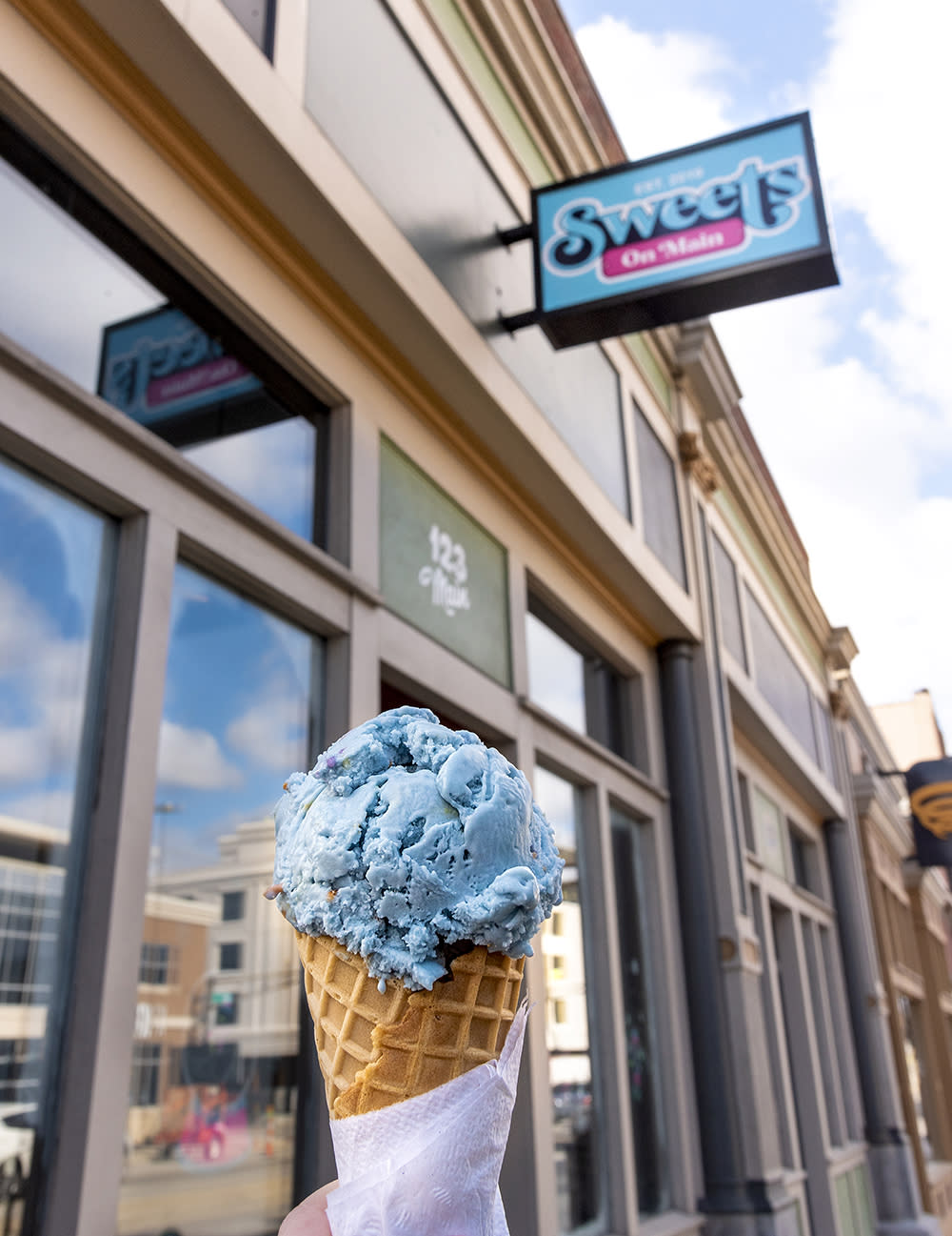 Birthday cake flavored ice cream in a waffle cone at Sweets on Main in downtown Fort Wayne