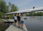 A group of students head to the water for practice in the rowing shell on National Learn to Row Day during Chautauqua in June. Photo by Ed Bernik