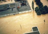 Aerial view of the Corning Museum of Glass surrounded by flood waters.
