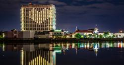 An image of Margaritaville Resort Casino Bossier City with windows lighted in a heart shape