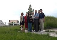 Christopher Colasurdo, wearing the uniform of a Union soldier, and his mother, Deborah, present a check for more than $1,000 to Chuck Harrington, president of Friends of Fort Ontario. The nine-year-old organized a fundraising drive to keep the NYS Historic Site open. From left are Brownie, the Fort Ontario mascot, board members Janet Clerkin and Gail Goebricher, Christopher and Deborah Colasurdo, and board members Eli Rapaport, Charles Harrington, Thom Shanken and Bill McCarthy.